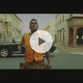 Man on the street wearing a life vest