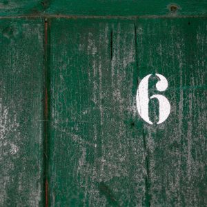 number six on a green door