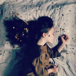 girl sleeping with stars in her hair